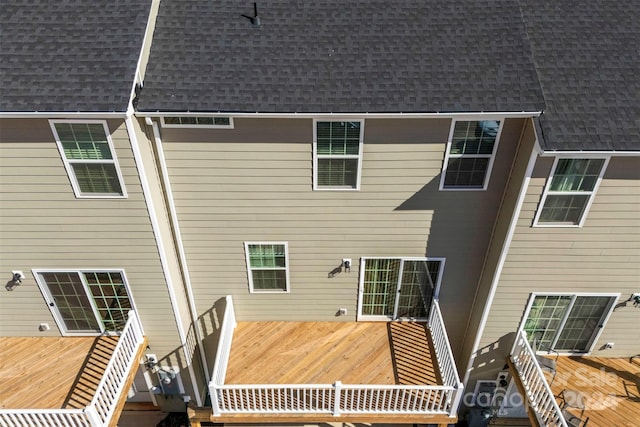 rear view of property with a wooden deck