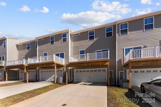 view of front of house with a balcony and a garage