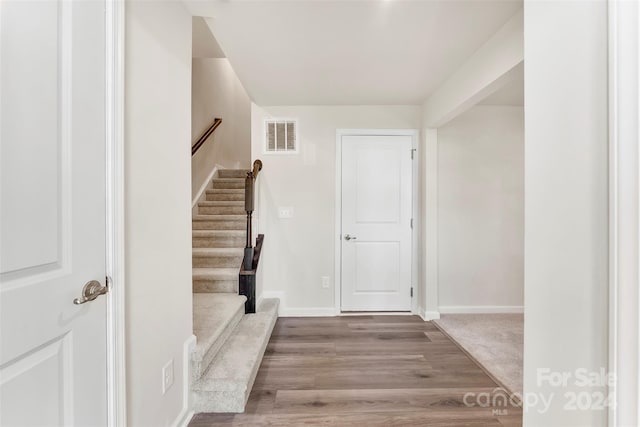 foyer with light hardwood / wood-style floors