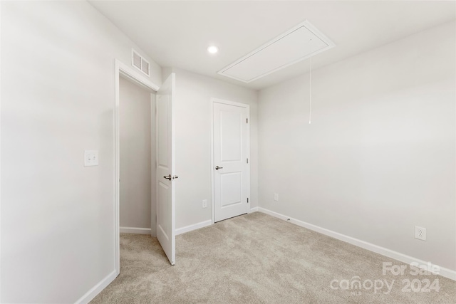 empty room with light colored carpet