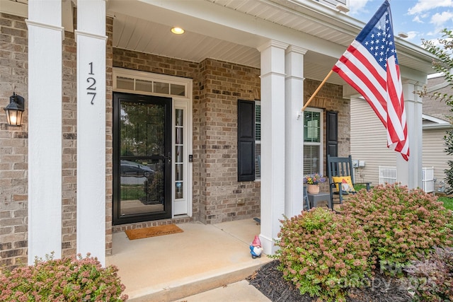 entrance to property featuring a porch