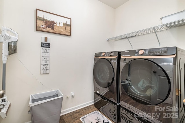 clothes washing area featuring dark wood-type flooring and separate washer and dryer