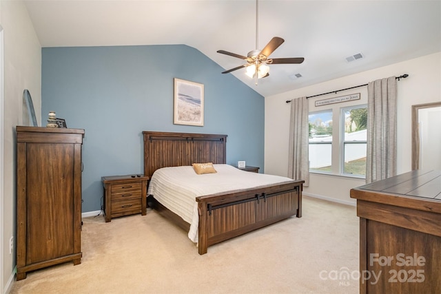 carpeted bedroom featuring vaulted ceiling and ceiling fan