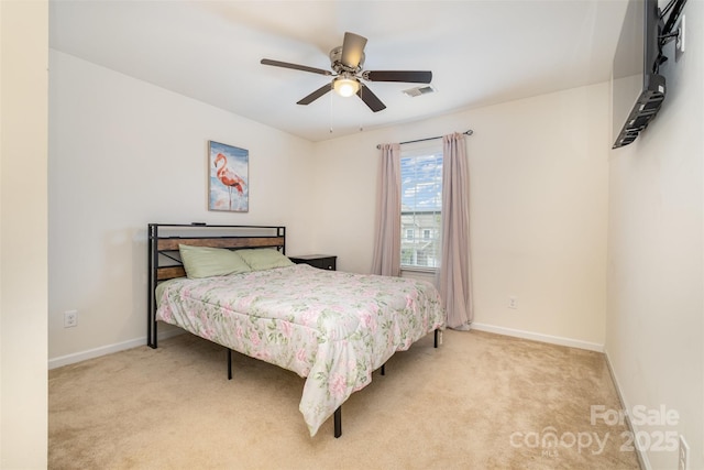 bedroom with light colored carpet and ceiling fan