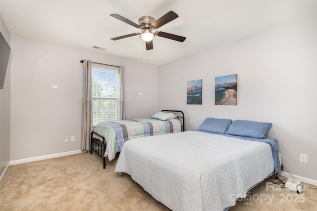 bedroom with ceiling fan and light colored carpet