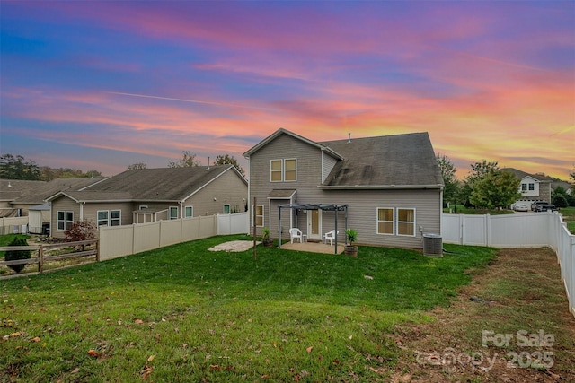 back house at dusk featuring central AC, a yard, a pergola, and a patio