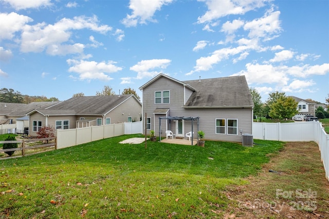 rear view of house with a patio, central AC unit, a yard, and a pergola