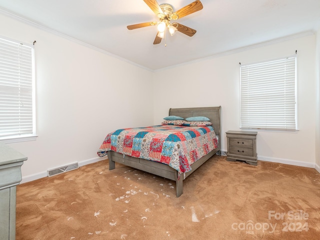 bedroom featuring carpet floors, ceiling fan, and ornamental molding