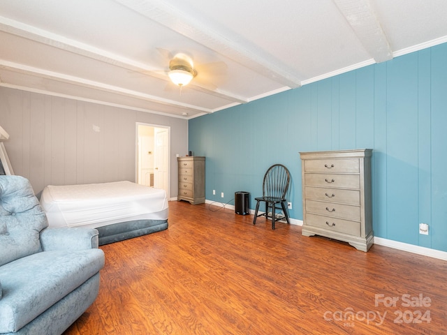 bedroom featuring beam ceiling, ceiling fan, ornamental molding, and wood-type flooring