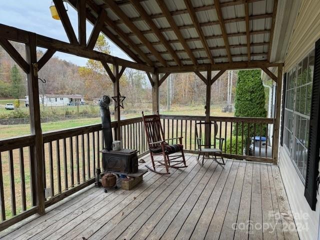 wooden deck with a yard and a gazebo