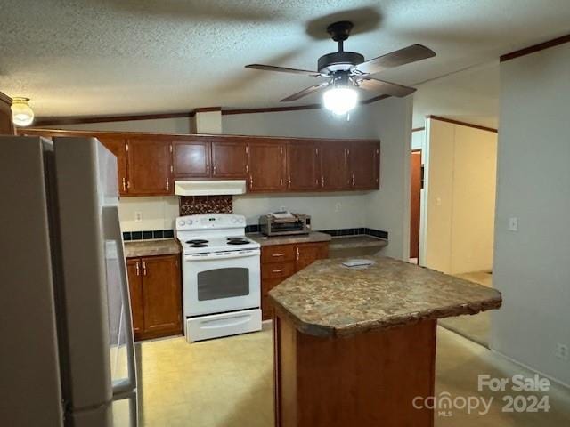 kitchen with a textured ceiling, lofted ceiling, white appliances, light colored carpet, and a center island