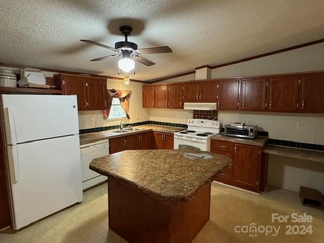 kitchen featuring ceiling fan, a textured ceiling, white appliances, a center island, and vaulted ceiling