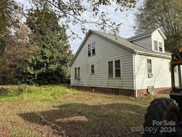 view of side of property featuring cooling unit