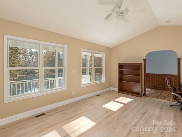 office space with light hardwood / wood-style floors, ceiling fan, and vaulted ceiling