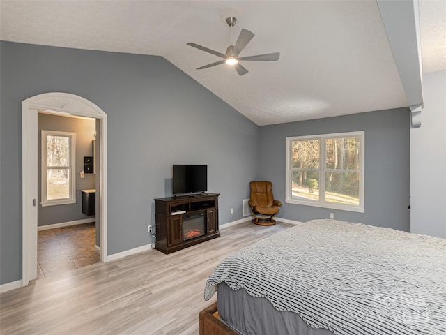 bedroom featuring vaulted ceiling, ceiling fan, and light hardwood / wood-style flooring