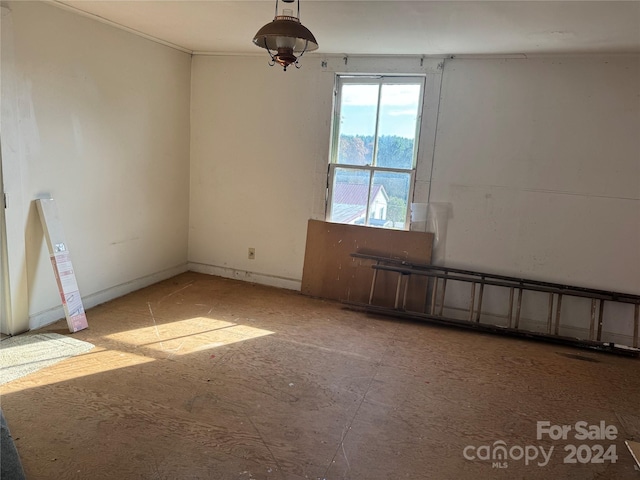 unfurnished room with a baseboard radiator