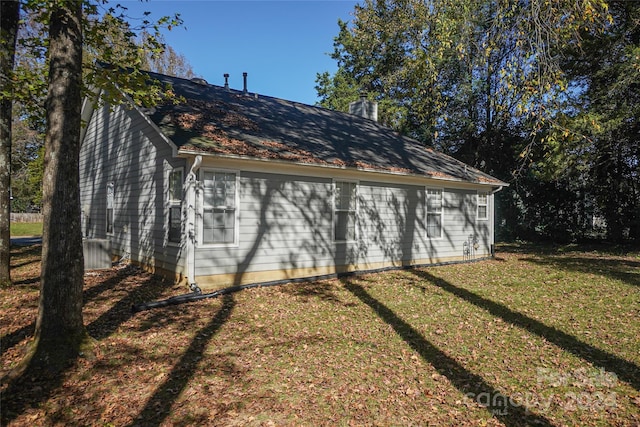 view of home's exterior featuring a lawn