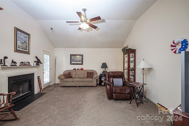 carpeted living room featuring ceiling fan and lofted ceiling