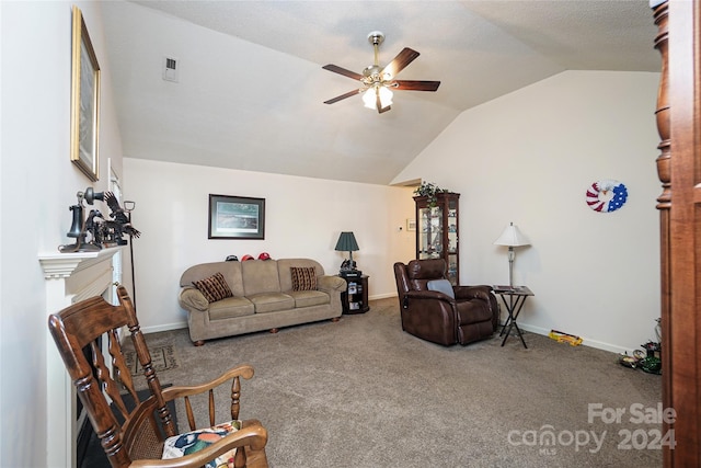 carpeted living room with vaulted ceiling and ceiling fan