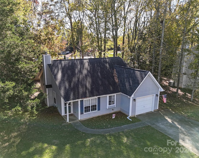 view of front facade featuring a garage and a front lawn