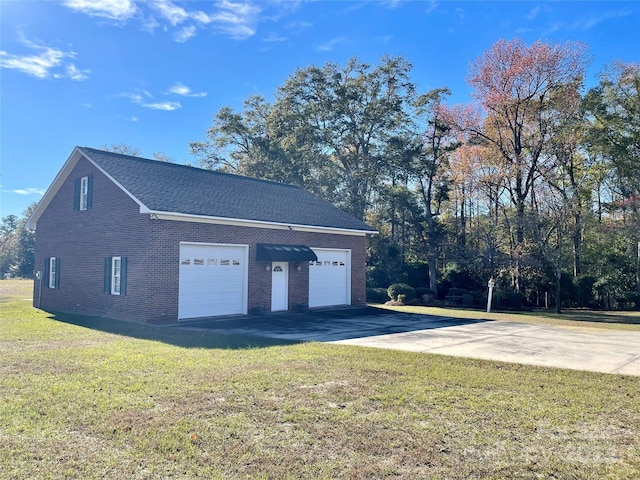 garage featuring a yard