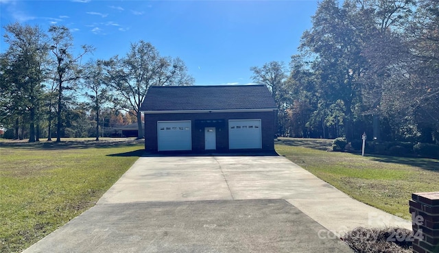 garage featuring a lawn