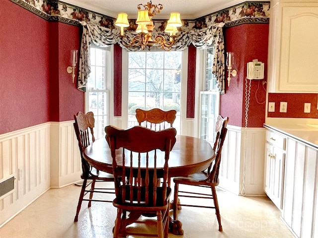 dining area featuring an inviting chandelier