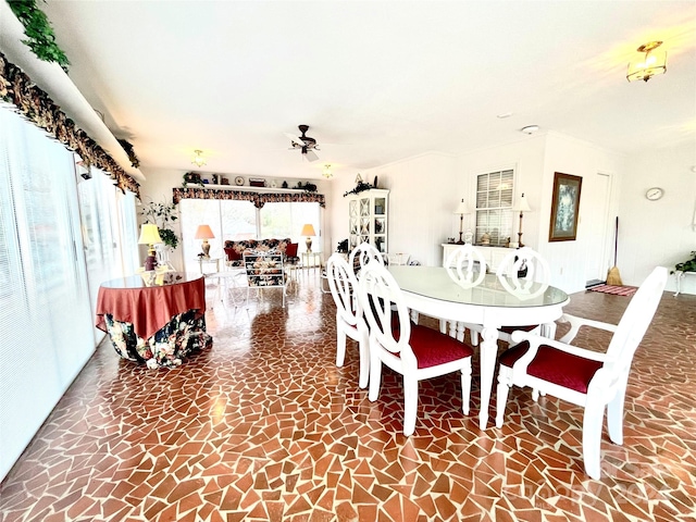 dining room featuring ceiling fan