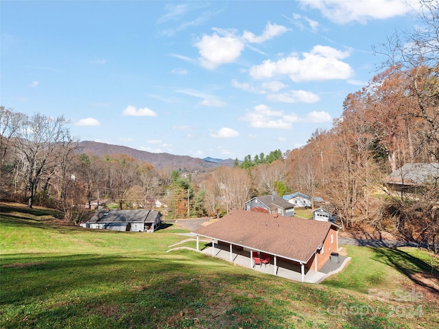 birds eye view of property featuring a mountain view