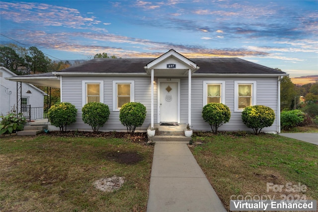 view of front of home featuring a yard