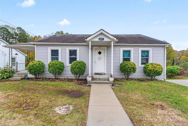 bungalow-style house featuring a front yard