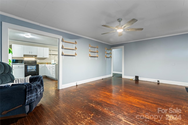 living room with dark hardwood / wood-style flooring, ceiling fan, ornamental molding, and sink