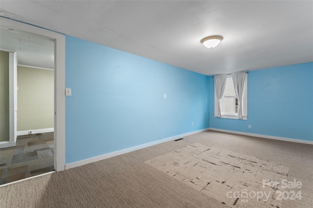 spare room with carpet floors