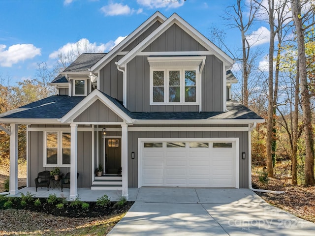 craftsman house with a porch and a garage