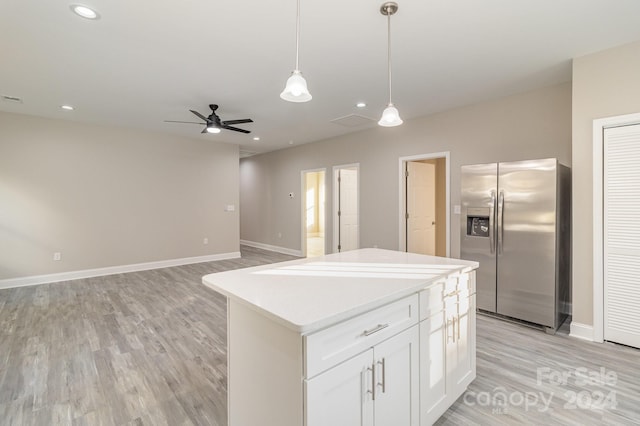 kitchen featuring white cabinets, stainless steel fridge with ice dispenser, light wood-type flooring, and a kitchen island