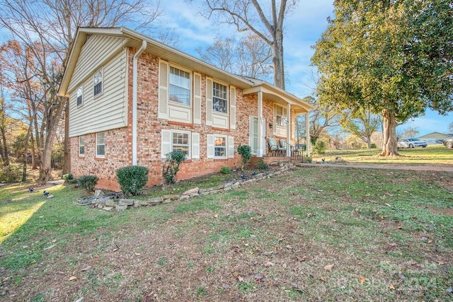 view of home's exterior featuring a yard