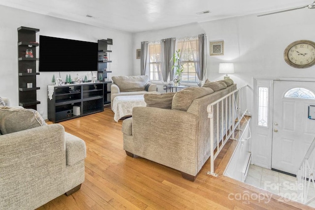 living room with light hardwood / wood-style flooring