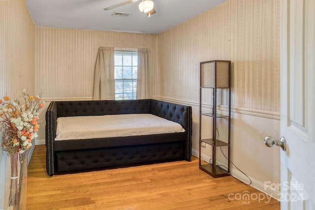 bedroom featuring light wood-type flooring and ceiling fan