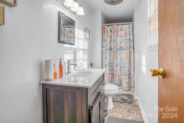 bathroom featuring a shower with curtain, tile patterned flooring, vanity, and toilet