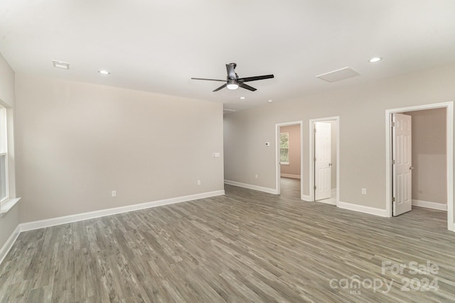 empty room featuring ceiling fan and hardwood / wood-style flooring