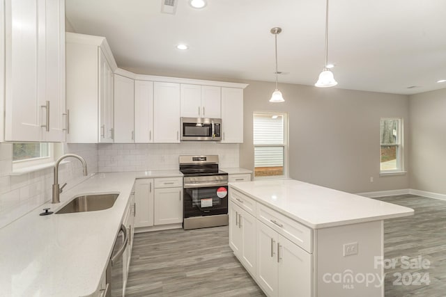 kitchen featuring sink, appliances with stainless steel finishes, and plenty of natural light