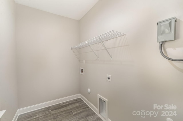 clothes washing area featuring hookup for a washing machine, dark hardwood / wood-style floors, hookup for a gas dryer, and electric dryer hookup