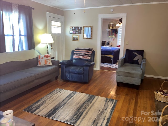 living room featuring crown molding, ceiling fan, and dark hardwood / wood-style floors