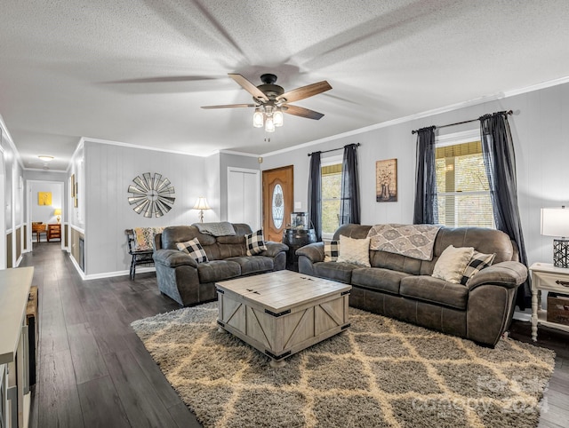 living room with a textured ceiling, dark hardwood / wood-style flooring, ceiling fan, and crown molding