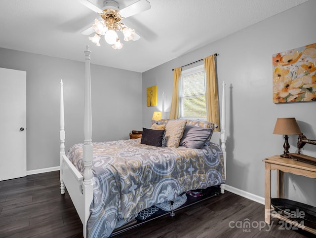 bedroom with ceiling fan and dark hardwood / wood-style flooring