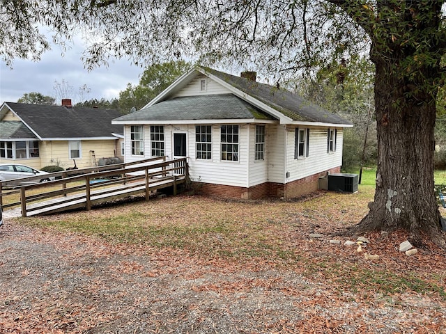 view of front facade with central air condition unit and a deck