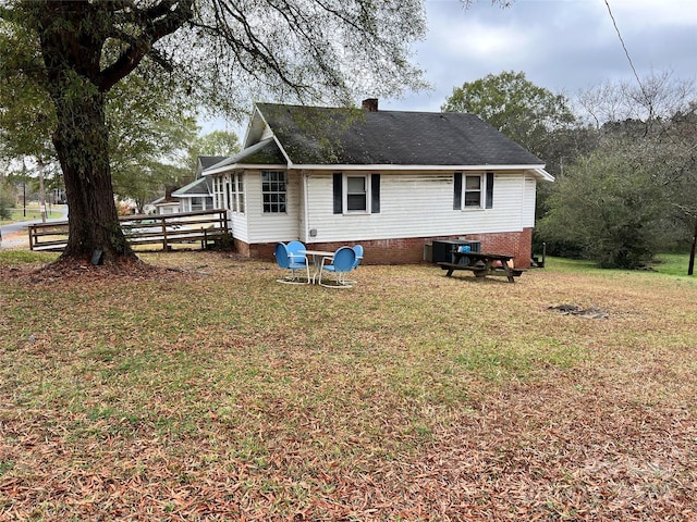 210 Lincoln St, Albemarle, NC 28001 - back of house with a chimney and crawl space
