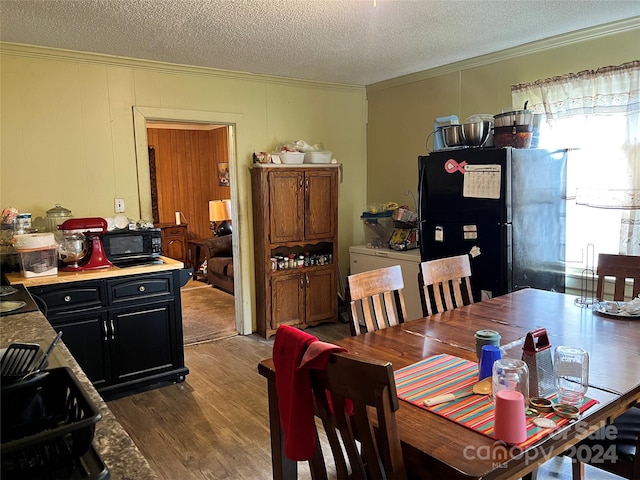 210 Lincoln St, Albemarle, NC 28001 - dining space with ornamental molding, dark wood-style floors, and a textured ceiling