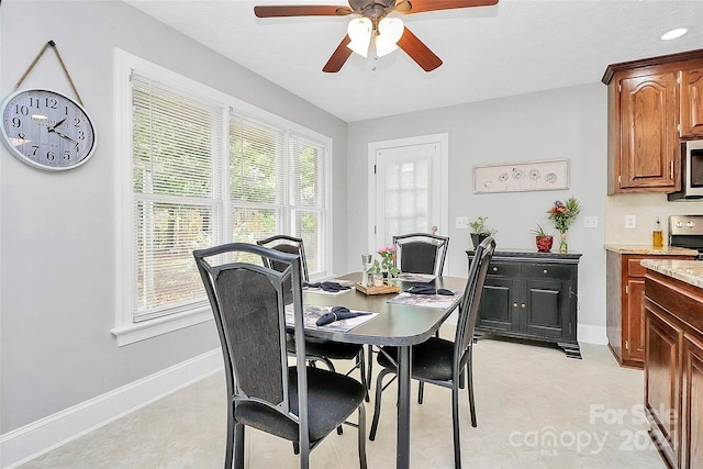 dining space featuring ceiling fan