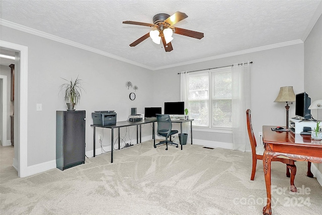 carpeted home office with a textured ceiling, ceiling fan, and crown molding